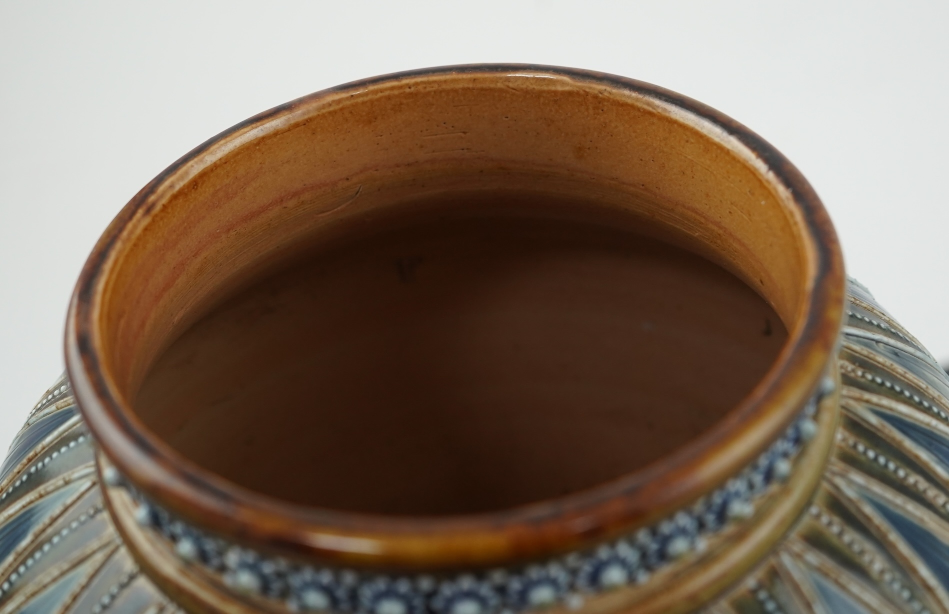 A Doulton Edith Lupton stoneware vase, drill hole to base, together with a similar Martha Rogers silver mounted cup, Tallest 31cm